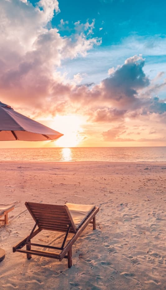 An image with deckchair sunset